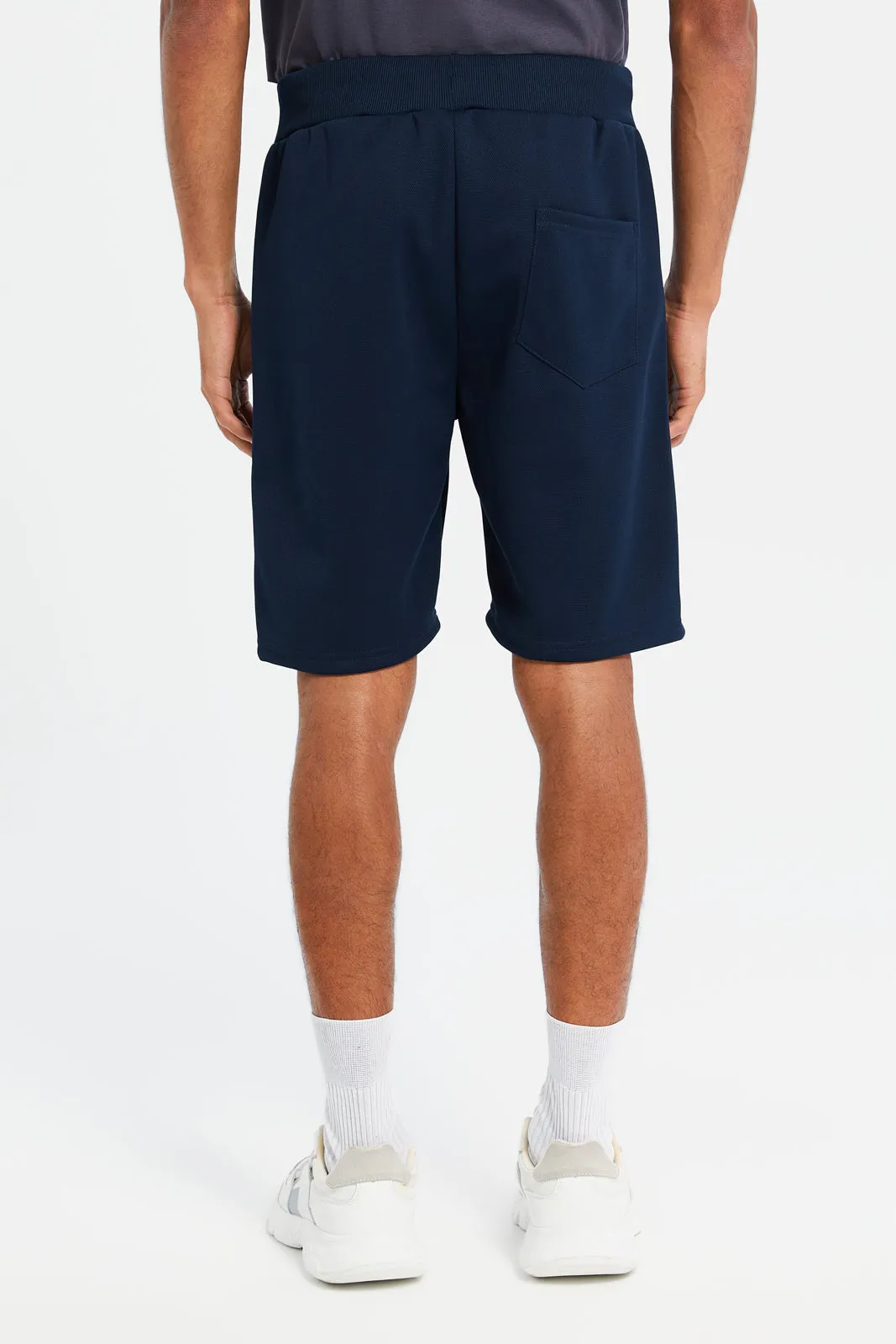 Men Navy Mid Rise Tech Shorts With Zip Pockets